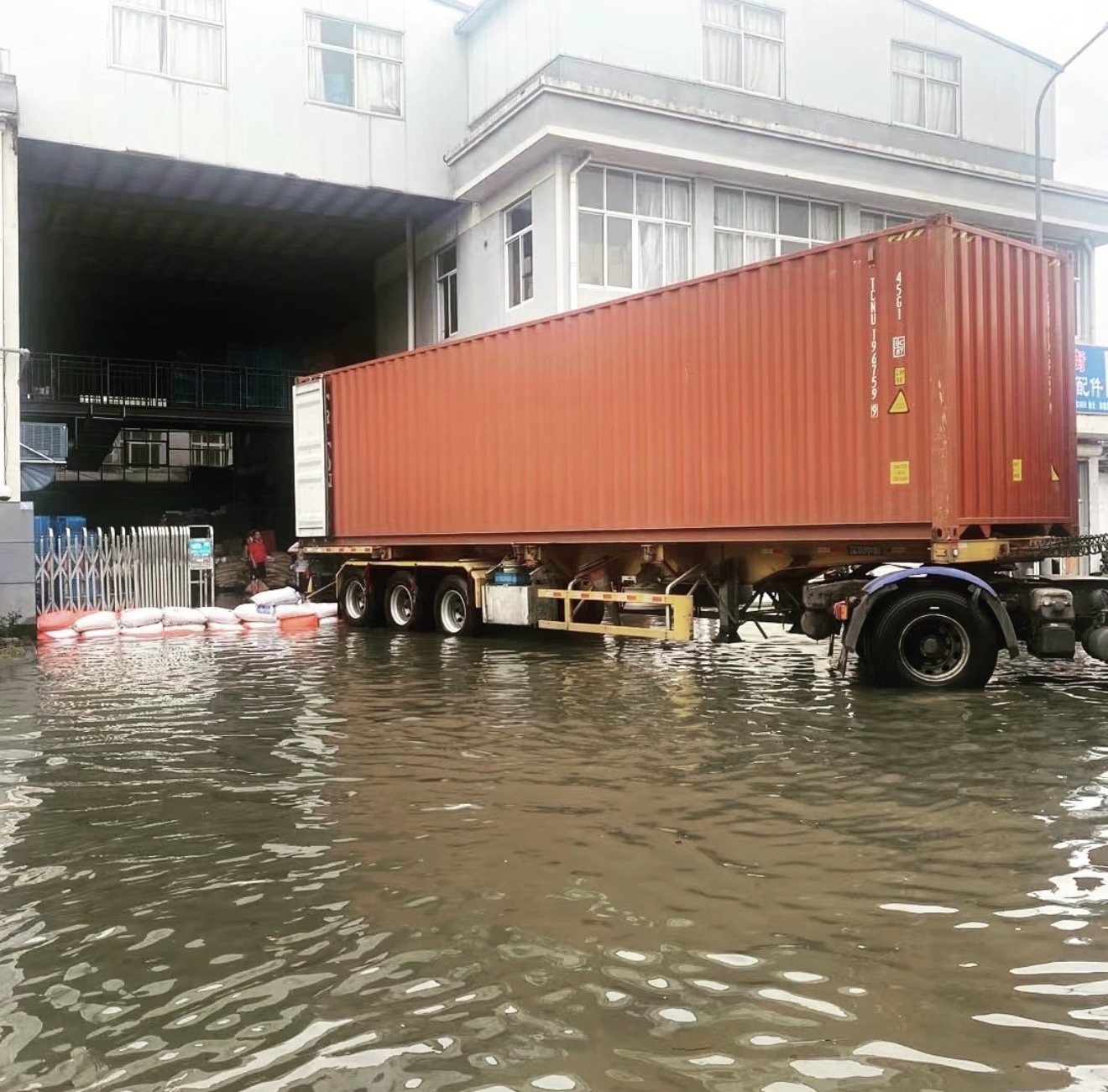 Loading a container in wind and rain at CHESS-MFG