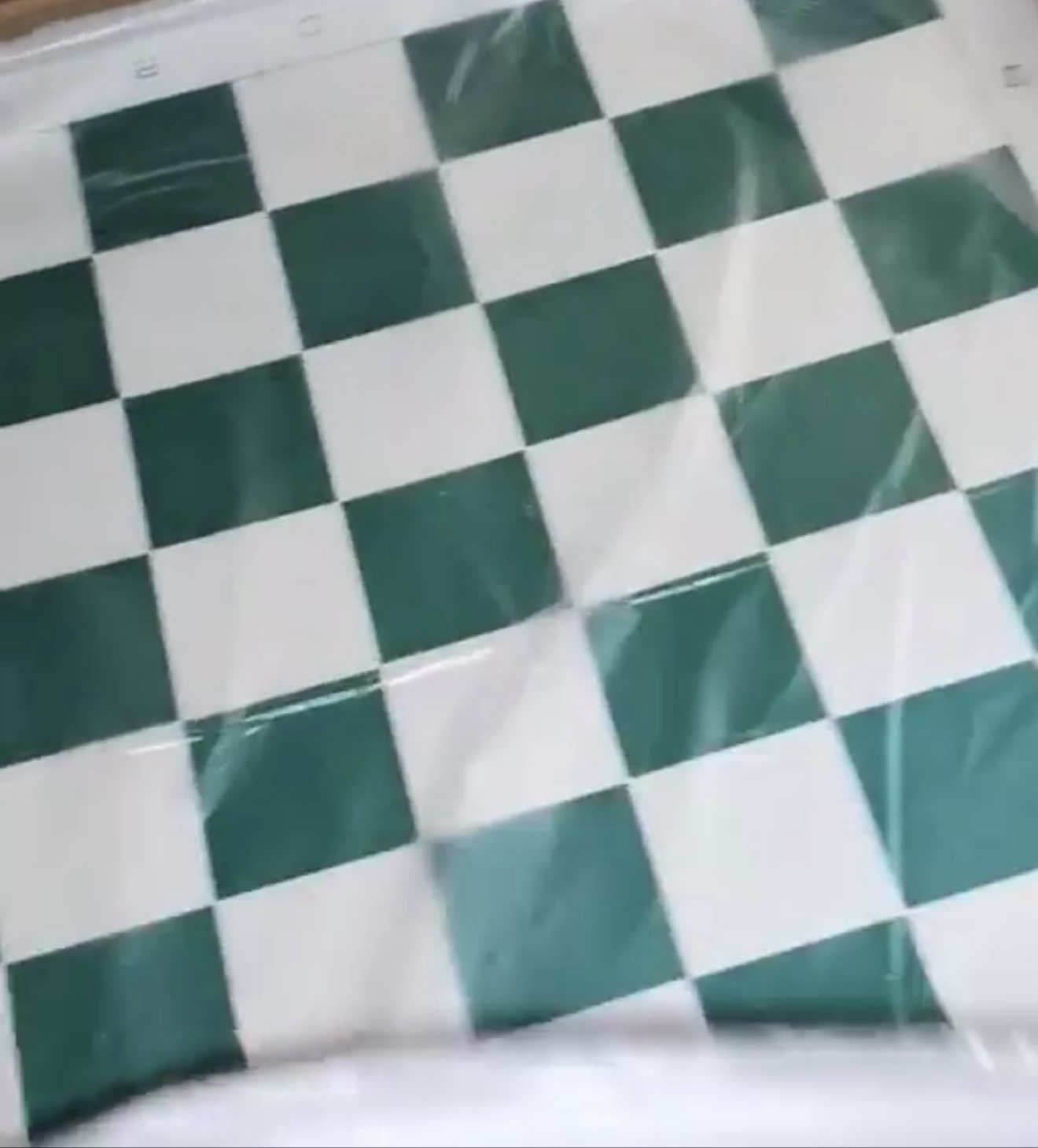 Green-and-white vinyl chess board